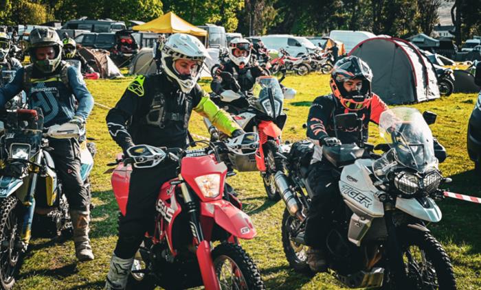 Riders planning a route at base camp